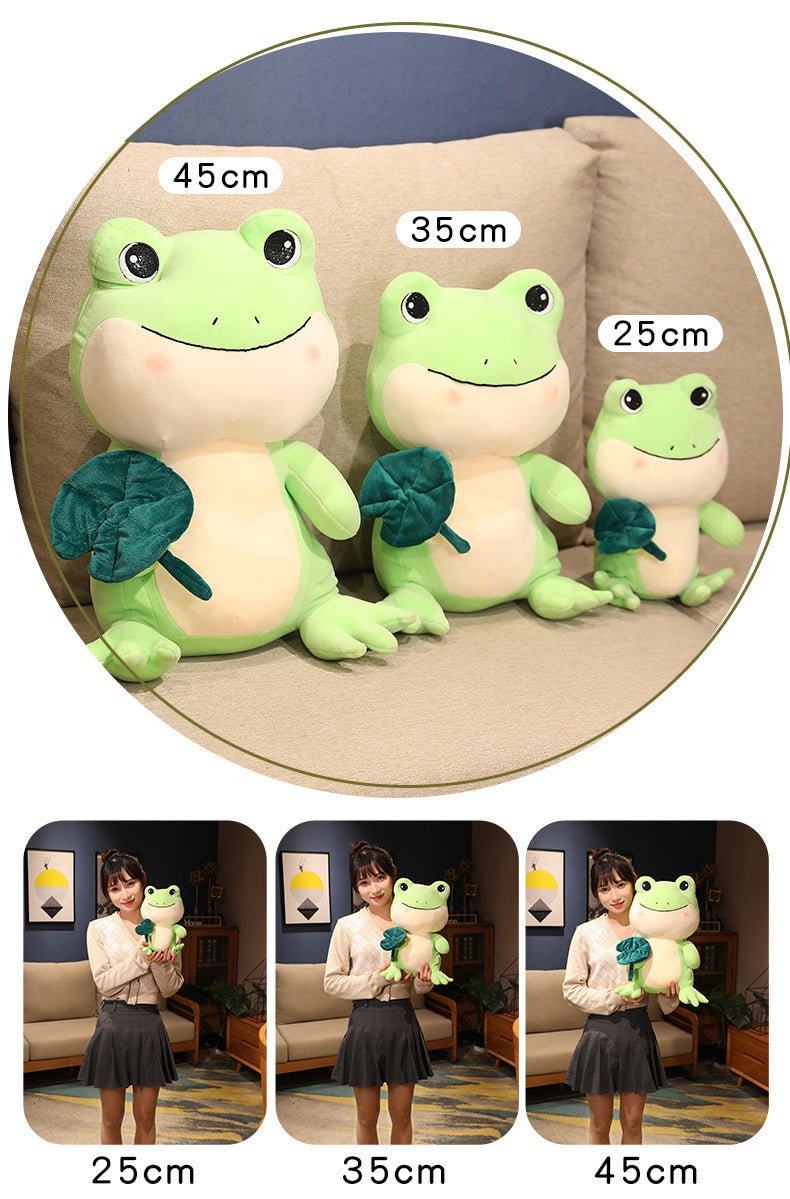 https://42shops.com/cdn/shop/products/green-pink-frog-plush-with-lotus-leaf-764762.jpg?v=1672311536&width=1445